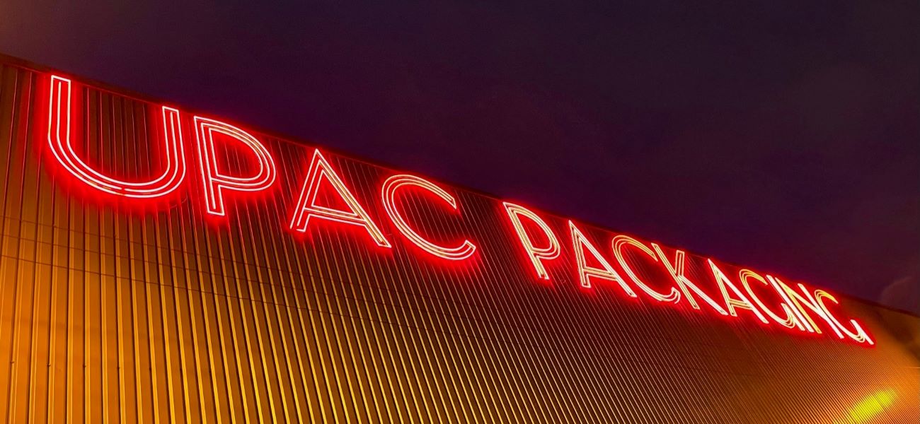 Large Custom Neon® building signage @theupacgroup