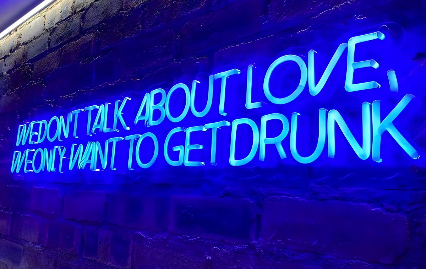 Custom Neon® blue home bar sign on distressed brick wall