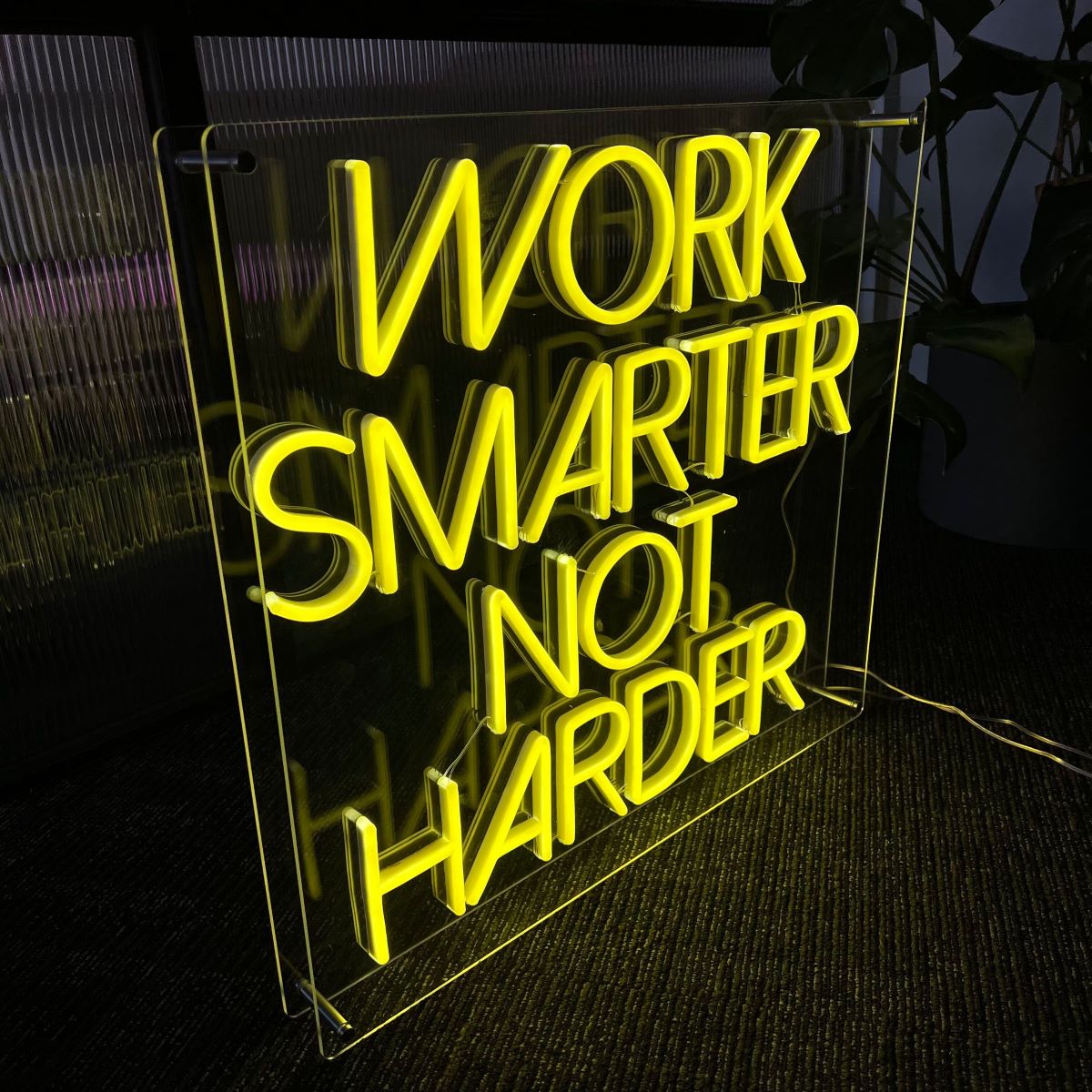 Work Smarter Not Harder motivational Custom Neon® office sign in an open acrylic box